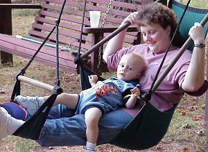 Sue and her son enjoy a quiet moment on the swings